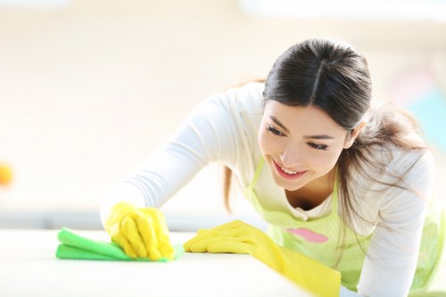 Professional carpet cleaner inspecting fabric condition before treatment
