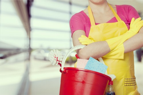 Local carpet cleaner treating stains with steam cleaning equipment