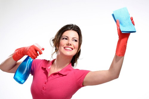 Local upholstery cleaner treating a fabric sofa