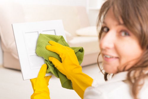 A cleaner finishing a window cleaning visit in Bromley
